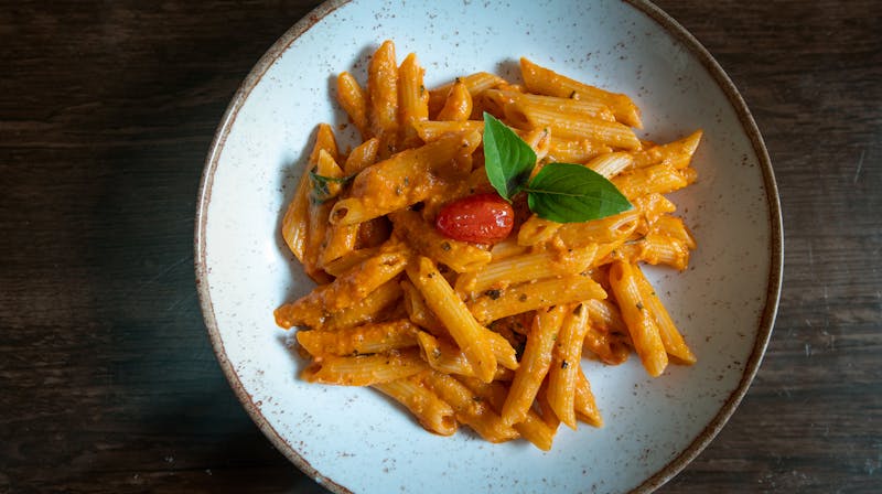 Penne pasta in creamy vodka tomato sauce