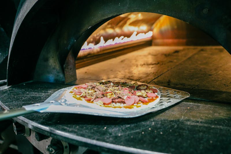 Coal-fired pizza being prepared in our kitchen